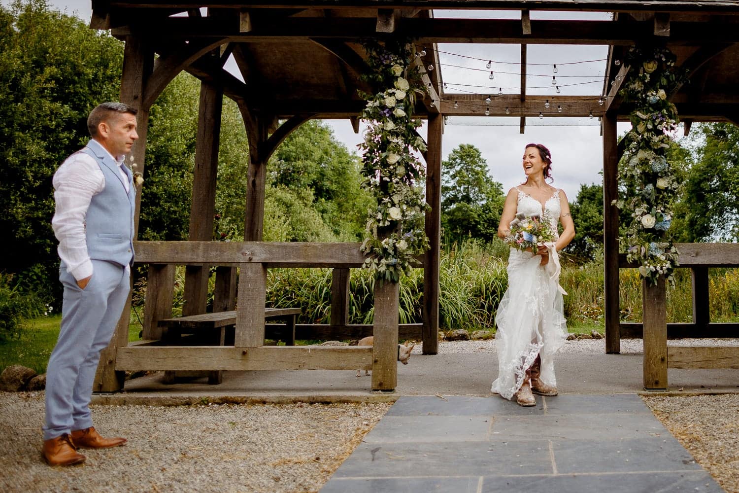 bride and groom at knightor winery’s wedding arbour